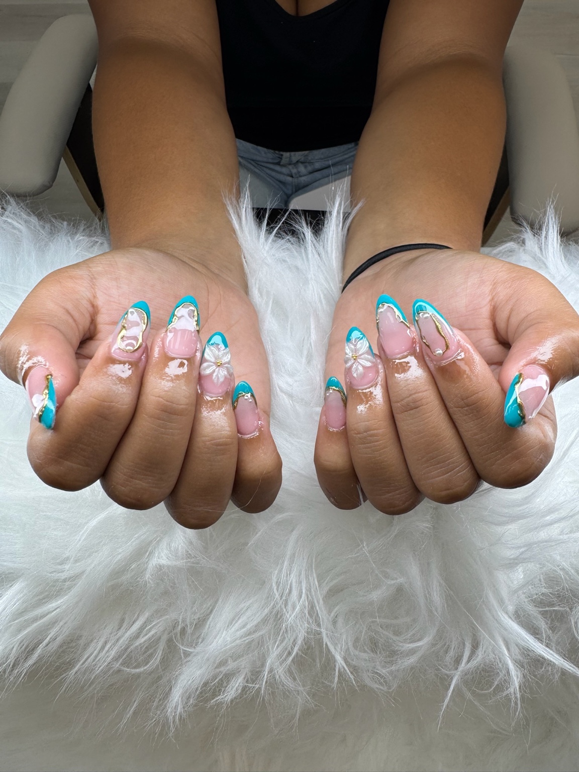 Turquoise floral Gel X nails created at EnVy Nails